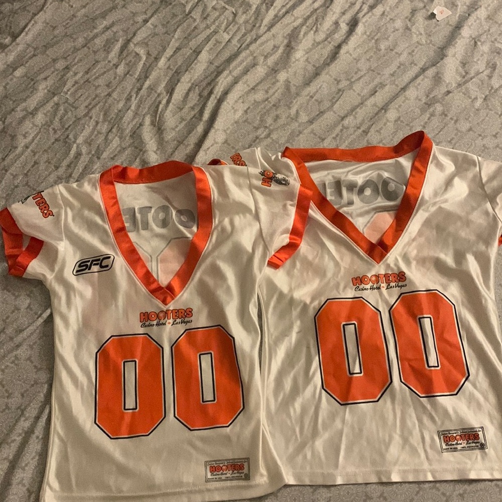 A white Hooters jersey- small and medium